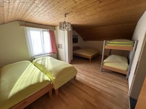 Postel nebo postele na pokoji v ubytování Bergnest Wildhaus