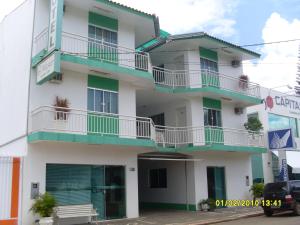 a building with balconies on the side of it at Hotel Master in Primavera do Leste