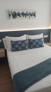 Postel nebo postele na pokoji v ubytování Alojamientos Dima Costa