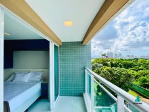 a bedroom with a bed on a balcony at Fortaleza Sul Style by Holiday Stays in Fortaleza
