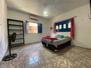 a bedroom with a bed in the corner of a room at Casa em Soure in Soure