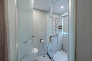 a bathroom with a shower and a toilet at Retro Taichung in Taichung