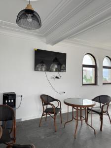 a dining room with a table and chairs at Hotel Black Sea Kobuleti in Kobuleti