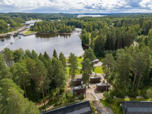 an aerial view of a lake with houses and trees at Koskisviitti 4 - Private High Quality Suite with Lake Views in Laukaa