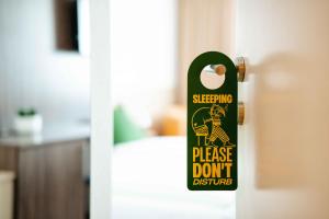 a skateboard is hanging on a door at SLEEEP Hotel Vösendorf in Vösendorf