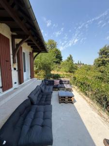 a row of couches sitting on a patio at Montignac Lascaux Home 