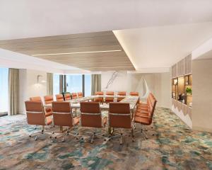 a conference room with a long table and chairs at Dorsett Hotel Canary Wharf in London