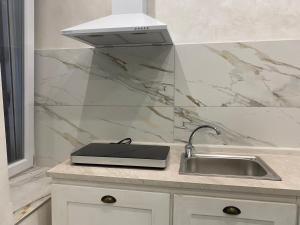 a kitchen counter with a sink and a stove at Lovers in Fiuggi in Fiuggi +31 photos