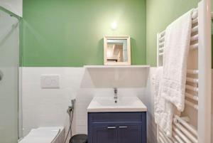 a bathroom with a sink and a mirror at Suite n15 - Design & Relax near the Navigli in Milan