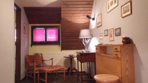 a room with a table and a chair and a desk at Ferienhaus Frieda in Kurort Altenberg