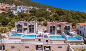 an aerial view of a villa with two swimming pools at Terranova Villas in Cukurbag