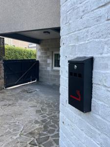 a black box on the side of a building at Foundry Street Apartment 3 - Dunfermline City Centre in Dunfermline