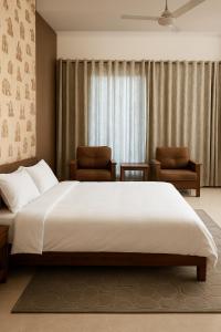 Postel nebo postele na pokoji v ubytování Dreamanor Blissful Stay Amritsar