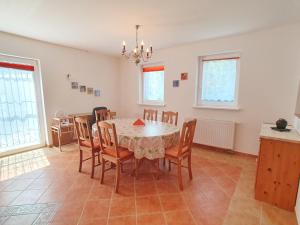 a dining room with a table and chairs at Nr 75 Holiday house Sigrid and Alfred in Gyenesdiás
