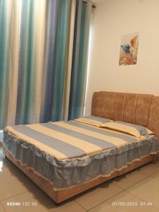 Katil atau katil-katil dalam bilik di RAISHa HOMESTAY +2 gambar