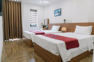 Ένα ή περισσότερα κρεβάτια σε δωμάτιο στο Blue Sea Hotel