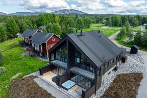 an overhead view of a home with a house at The Lakeview by Hilla Villas in Äkäslompolo