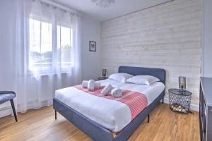 Giường trong phòng chung tại Villa Manava - Climatisée avec terrasse et jardin