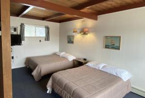 Postel nebo postele na pokoji v ubytování Villa De Moderne - adoba Inn Charlevoix