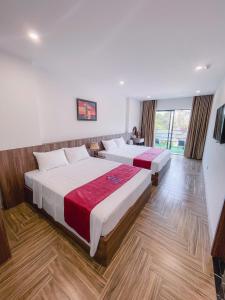 Ένα ή περισσότερα κρεβάτια σε δωμάτιο στο Blue Sea Hotel +1 φωτογραφίες