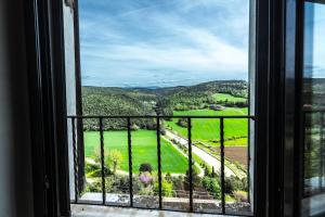 a window with a view of a green field at Suite Paradiso Umbria 15 minutes A1 Rome 1 hour in Amelia