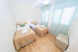 Кровать или кровати в номере 180Home COQUETO APARTAMENTO EN CALLE SIERPES
