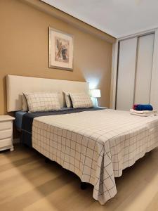 Ένα ή περισσότερα κρεβάτια σε δωμάτιο στο MNG-Apart Paradise Court