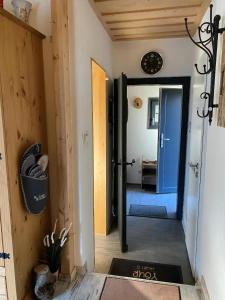 a hallway with a door leading into a room at Herzhütte Für Zwei in Vichtenstein