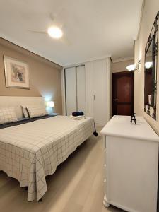 Ένα ή περισσότερα κρεβάτια σε δωμάτιο στο MNG-Apart Paradise Court