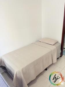 Ένα ή περισσότερα κρεβάτια σε δωμάτιο στο Ilhas de Creta 302