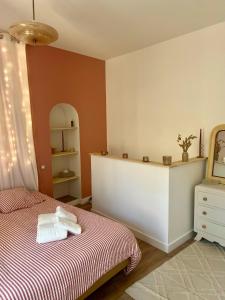a bedroom with a bed and a mirror at Love room - Casa Lova in Saussan