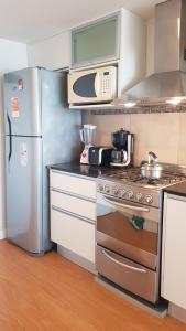 Nhà bếp/bếp nhỏ tại Departamento con cochera vista al mar