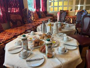 a table with plates of food on it at Hotel Saint Antoine in Tafraout