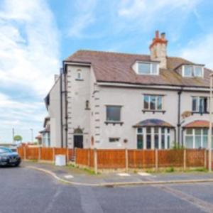 a building with a car parked in front of it at 2 Bed Apartment ,Sea Views in Blackpool