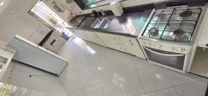 an overhead view of a kitchen with a stove at Quarto Clara in Sao Paulo +5 photos