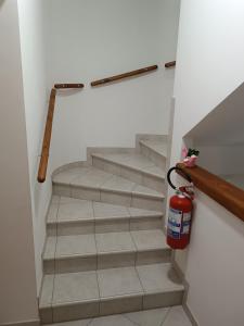 a staircase with a fire hydrantacistacistacistacist at B&B "LE LUCI" CAMERA IN ATTICO SUPER VISTA interno 2 rose rosa in Vasto