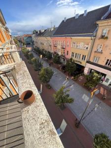 an aerial view of a city street with buildings at Monaco in Šiauliai