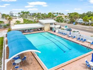 an overhead view of a swimming pool at a resort at Cozy Home Near the Beach - Aloha Kai #37 - Roelens in Siesta Key