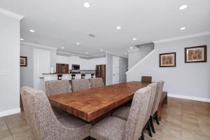 a dining room with a wooden table and chairs at Glorious Home Near Disney With Game Room, Themed Rooms, Waterpark & Resort Access At Encore Resorts Reunion - 7643Wi in Kissimmee +33 photos