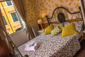 a bedroom with a large bed with a window at Casa Fanti 57 in Rome