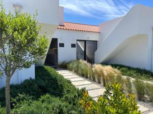 a white house with a pathway at Casa Beliche in Aljezur