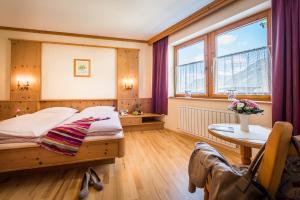 Posteľ alebo postele v izbe v ubytovaní Appartementhaus Alpenrose