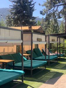 a row of empty chairs and tables on the grass at Station House Inn South Lake Tahoe in South Lake Tahoe