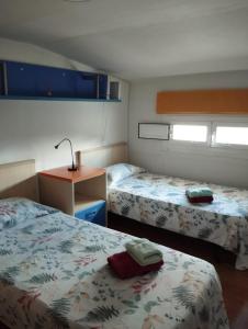 Ένα ή περισσότερα κρεβάτια σε δωμάτιο στο Apartamento El Cielo de Jesi