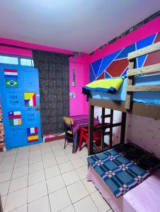 a room with a bunk bed and a table at Backpacker hostal oruro in Oruro +27 photos