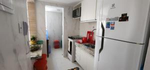 Køkken eller tekøkken på Duplex novo e mobiliado em Vilas