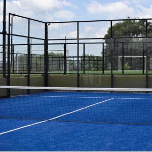 a tennis court with a net on a court at Veneto Village in Villa Parque Siquiman