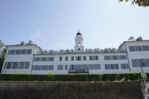 a white building with a lighthouse on top of it at F5 - 2 Zimmer Wohnung in Offenbach