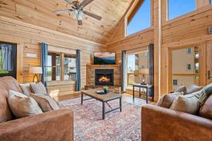 a living room with a couch and a fireplace at Rustic Retreat By Avada Properties in Greystone Heights