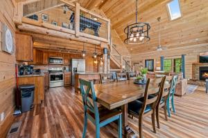 a dining room and kitchen with a table and chairs at Rustic Retreat By Avada Properties in Greystone Heights